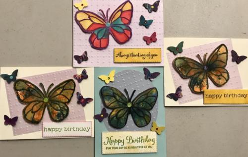 Medley of butterfly brusho and vellulm cards.